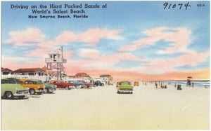Driving on the hard packed sands of world's safest beach, New Smyrna Beach, Florida
