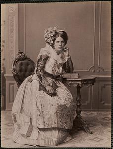 Studio portrait of woman in traditional Greek dress