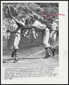 Safe--Joe Fioravanti, Levittown, Pa. outfielder, bends his back to escape the tag by Dick Nelson, Lakewood, Calif. pitcher as Fioravanti scored from third on a wild pitch in fifth game of Little League World Series at Williamsport. Levittown won 9-1.