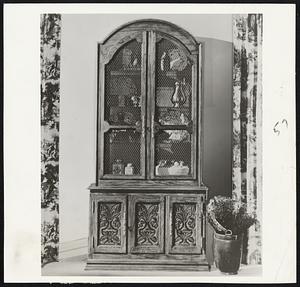 Cabinet Makers of the French country side, in the late 17th and early 18th centuries, freely interpreted forms and adapted designs from England, Spain and Italy. This graceful cabinet for living or dining room combines some of these same motifs. But distinguishing it as an American piece of today, is the walnut wood, with its flowing graceful figures.