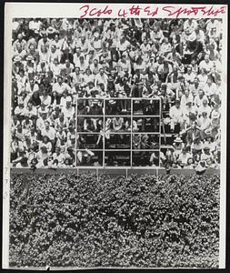 Visibility Blue-Out in Chicago, a blue plastic curtain goes into position at Wrigley Field to offset the white-shirt bleachers background that has been troubling batters and catchers on fast pitched balls.