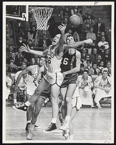 Toby Kimball and Jerry Lucas battle for rebound as Wayne Embry (in background) looks on.
