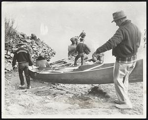 The Takeoff--Dartmouth College students heading down the Connecticut River to Long Island Sound by canoe get a start at Hanover, N.H., at sunrise. The distance is 220 miles. Four canoeists who finished the trip this year took 71 hours. The record is 58 hours, set 20 years ago.