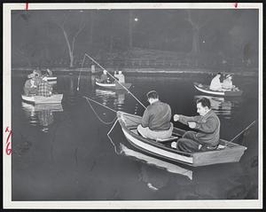 Early bird anglers at Jamaica Pond at 4 am for start of mass fishing season