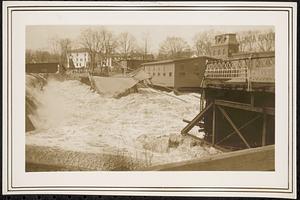 Main Street bridge being destroyed by flood waters