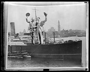 Photomontage of two men waving their hats pasted onto a ship