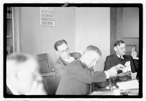 Group of men at table