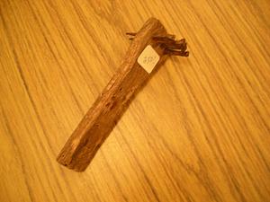 Wooden object with nails