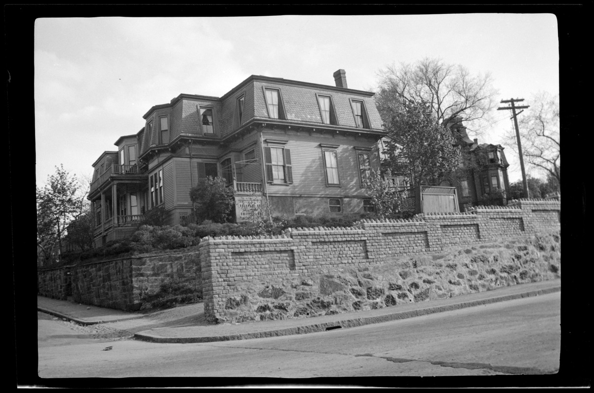 42 Highland Ave, Roxbury, Mass., showing a new wall built on top of an old Roxbury "Puddingstone" wall, along the road way. A P. W. A. project 1936
