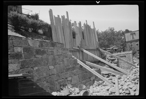 Rebuilding the big wall, 42 Highland Ave. Roxbury, Mass., part of new wall at the left of picture