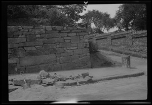 Rebuilding the big wall, 42 Highland Ave. Roxbury, Mass., wall completed but not pointed and cap stones not in place