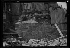 Rebuilding the big wall, 42 Highland Ave. Roxbury, Mass., part of completed wall at left of the picture