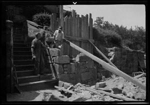 Rebuilding the big wall, 42 Highland Ave. Roxbury, Mass., beginning the job near the steps, Thomas P. Mulvey Sr. and Jr. in the picture
