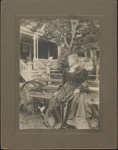 Mrs. Warren G. (Cynthia) Roby sitting on the lawn in front of her home on Concord Road