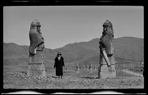 Hazel Bucklin standing in between statues