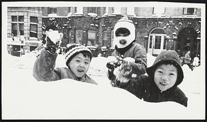 Attacking the photographer on Hemenway St. From left: Kenny Moy, 6; Ellen Moy, 8; Edward Kwok, 7