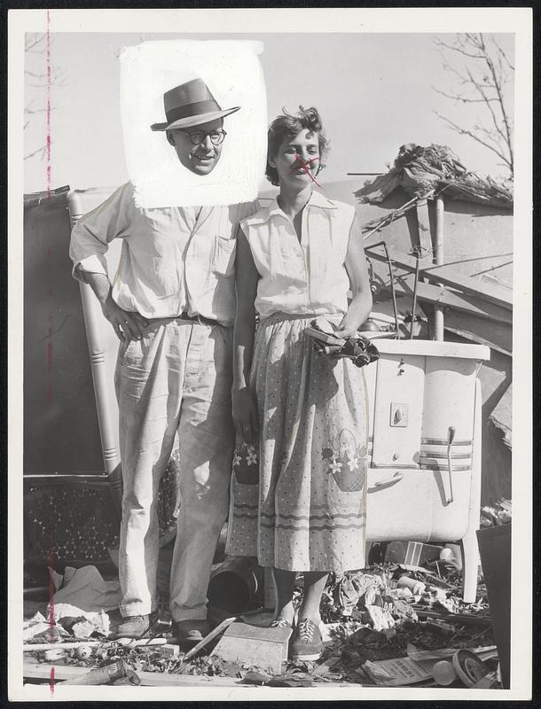 Smiling Bravely and set for a new start are Mr. and Mrs. Stanley Szlyk; whose home at 29 Edgewood drive, Winthrop Oaks, Holden, was leveled by Tuesday's tornado.