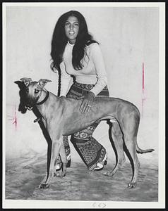 Lucille Giganti of Everett. Dog - “Evening Glamour”. 6-2-1 in 9 races. 19 victories is record. Has shot at record