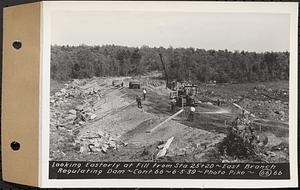 Contract No. 66, Regulating Dams, Middle Branch (New Salem), and East Branch of the Swift River, Hardwick and Petersham (formerly Dana), looking easterly at fill from Sta. 25+20, east branch regulating dam, Hardwick, Mass., Jun. 5, 1939