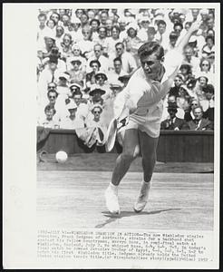 Wimbledon Champion in Action--The new Wimbledon singles champion, Frank Sedgman of Australia, strains for a backhand shot against his fellow countryman, Mervyn Rose, in semi-final match at Wimbledon, England, July 2. He whipped Rose, 6-4, 6-4, 7-5. In today's final match he downed Jaroslav Drobny of Egypt, 4-6, 6-2, 6-3, 6-2 to notch his first Wimbledon title. Sedgman already holds the United States singles tennis title.