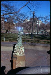 A sculpture in front, Edward Everett Hale Monument in background, Boston Public Garden