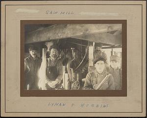 Sawmill workers in saw mill (closeup)