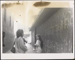 Young people walking in an alley