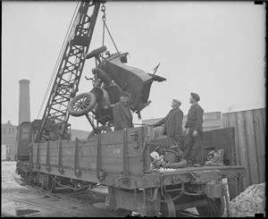 Demolished auto loaded onto Boston & Maine Car