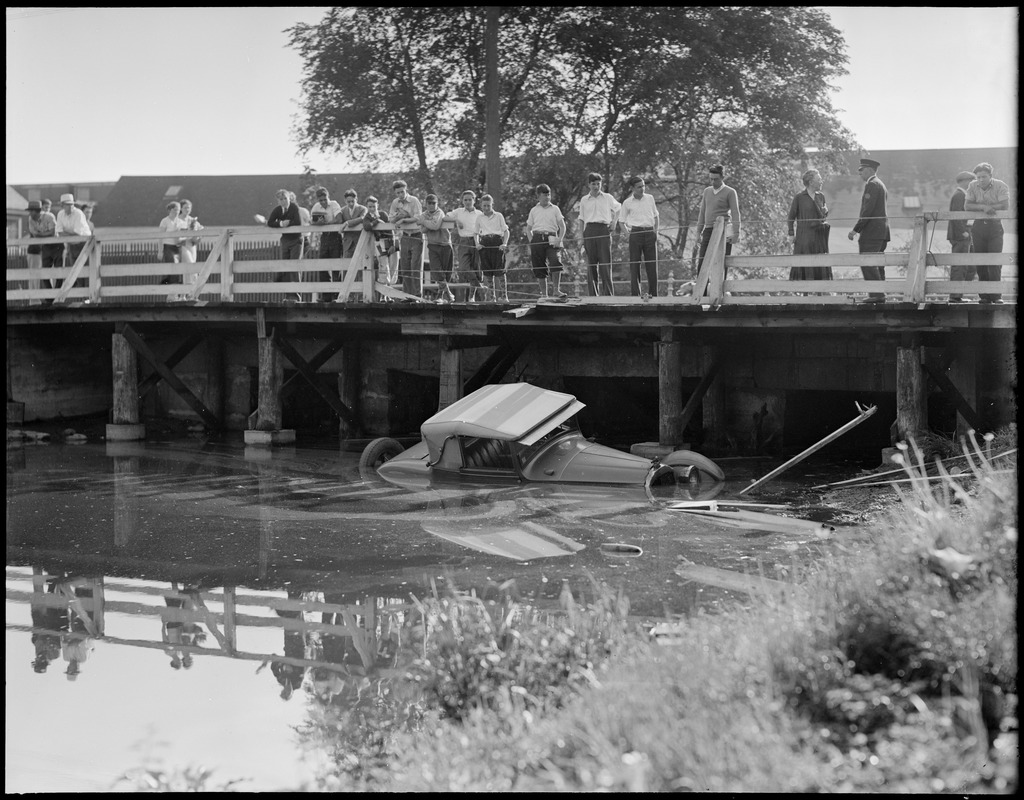 Auto goes off bridge and into water