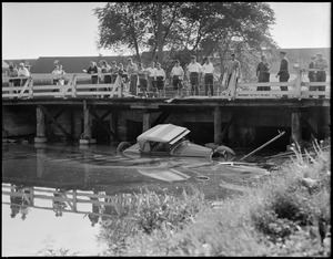 Auto goes off bridge and into water