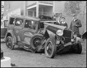 Boys with damaged car