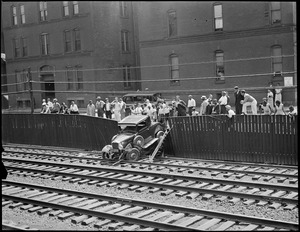 Auto goes out of control and crashes through fence onto B&A Tracks near Greenwich Park, South End