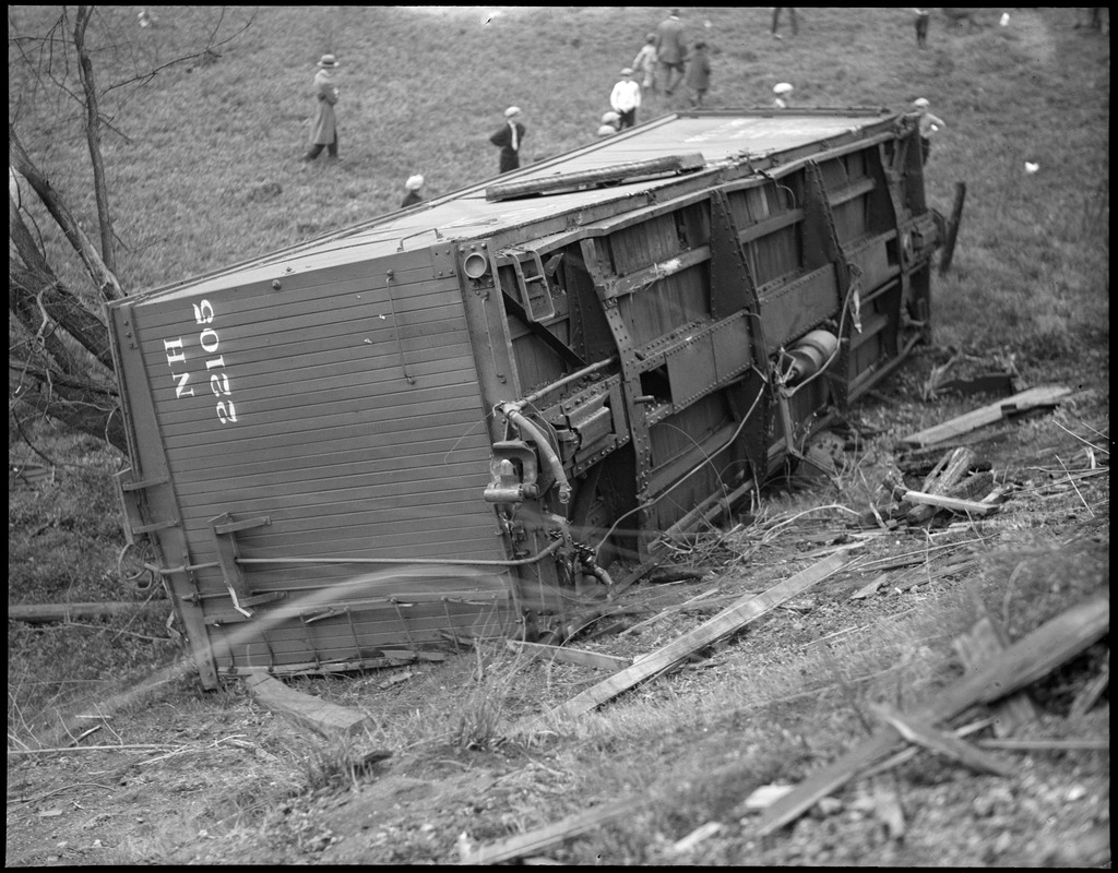 Freight car derails, tumbles off track