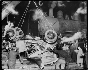 Three rescued from under engine. Two men & boy were in auto that was ground beneath locomotive and dragged 200ft by Erie R.R. In Hoboken, N.J.