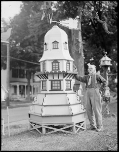 Old man with model building