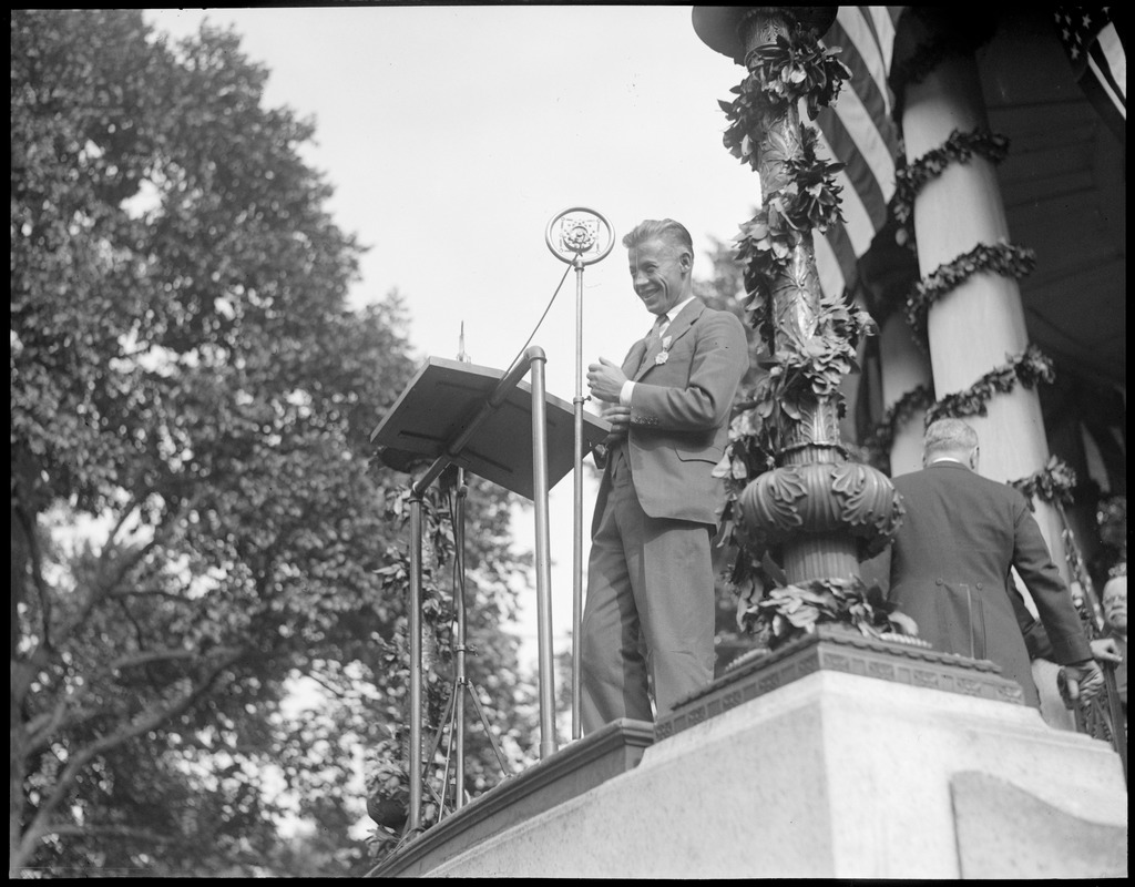 Wilmer Stultz talking over the radio at the Parkman bandstand, Boston