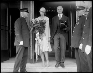 Miss Amelia Earhart and Mayor Edward Larkin of Medford, MA leaving the Ritz-Carlton Hotel