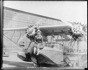 Mrs. Frances Grayson with her plane Dawn. She was lost with craft and never found.