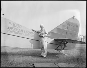 Russell Boardman and his plane he is to fly across the ocean from East Boston Airport. Before it was burnt.
