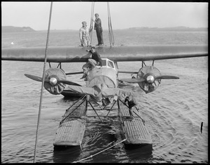 Byrd's South Pole plane in water off East Boston after being fitted with pontoons