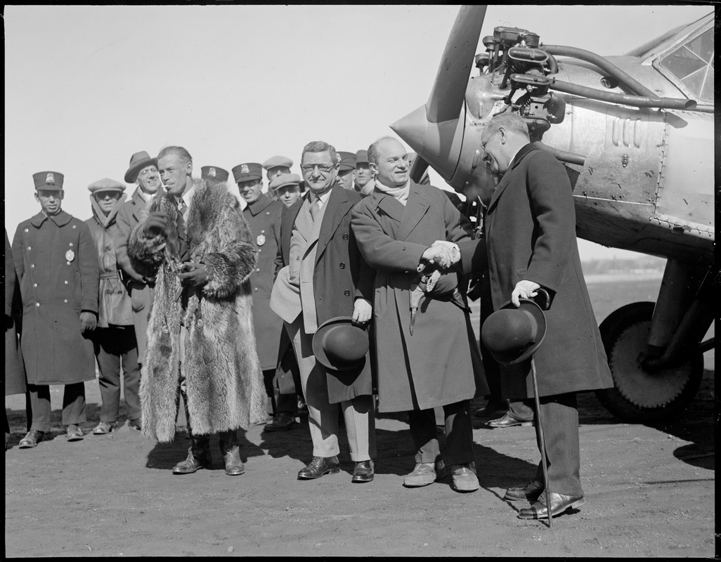 East Boston Airport in front of famous Columbia R-R: Wilmer Stultz (pilot), Charles Innes, Charles A. Levine, Mayor Malcolm Nichols