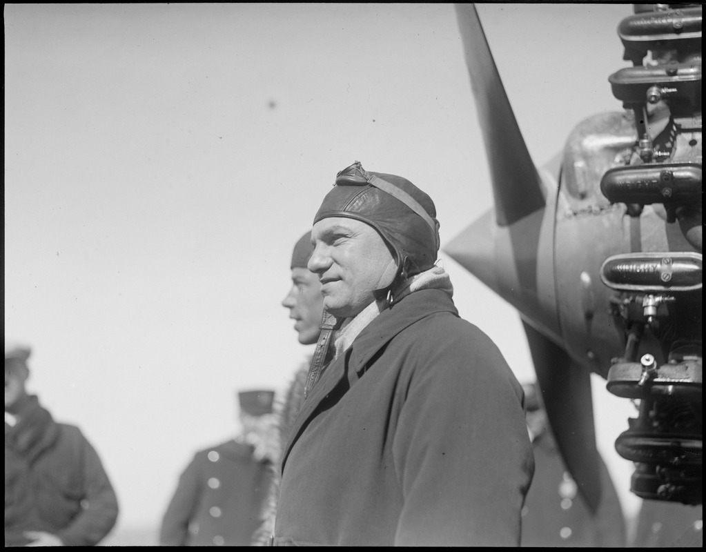 Foreground - Charles A. Levine. Background - pilot Wilmer Stultz arriving at East Boston Airport.