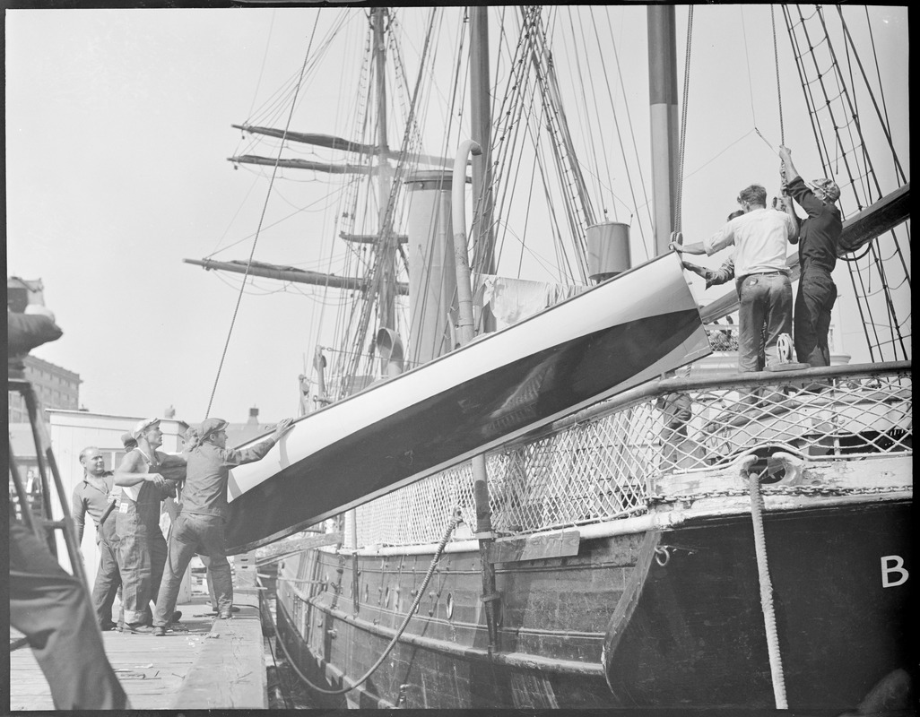 Crew hoisting boat onto Commander Byrd's Bear of Oakland