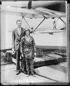 Col. Lindbergh and wife get ready to fly the Pacific