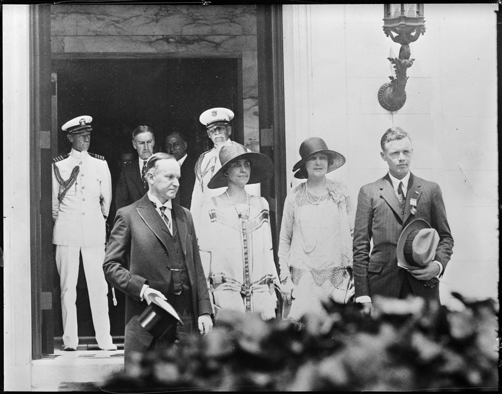 Mrs. and Col. Lindbergh with Pres. and Mrs. Coolidge in front of temporary White House in Washington.