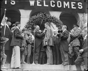 Lindy being decorated by Gov. Fuller