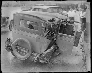 Bandits car wrecked at Grove Hall, Dorchester. Showing the guns taken from the three youngsters