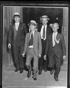 Jack "Legs" Diamond and attorneys, leaving federal court in New York. Convicted of owning an unlicensed still and conspiring to violate the Prohibition laws.