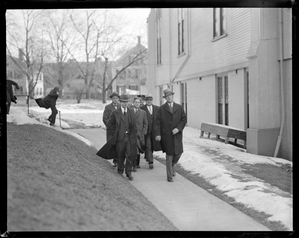 Russell Noble (no hat), 17, of Haverhill, leaving for jail. Killed Mrs. Clara E. C. Ellis, wealthy widow, with a hammer.