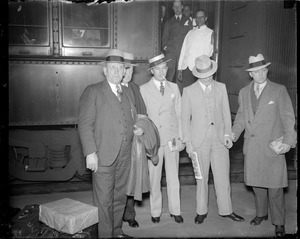 Solomon murder. Two suspects held. Burke - (soft hat) Frank Karlonas - (straw hat) .